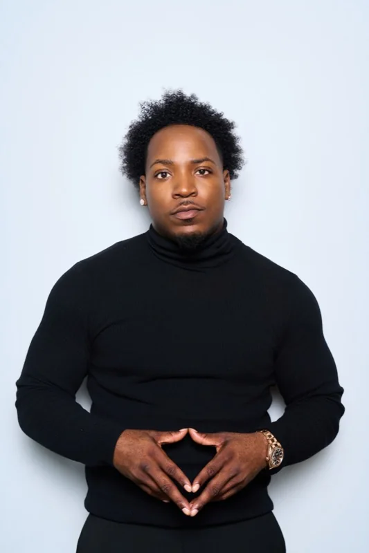 Jet in a black turtleneck, studio portrait